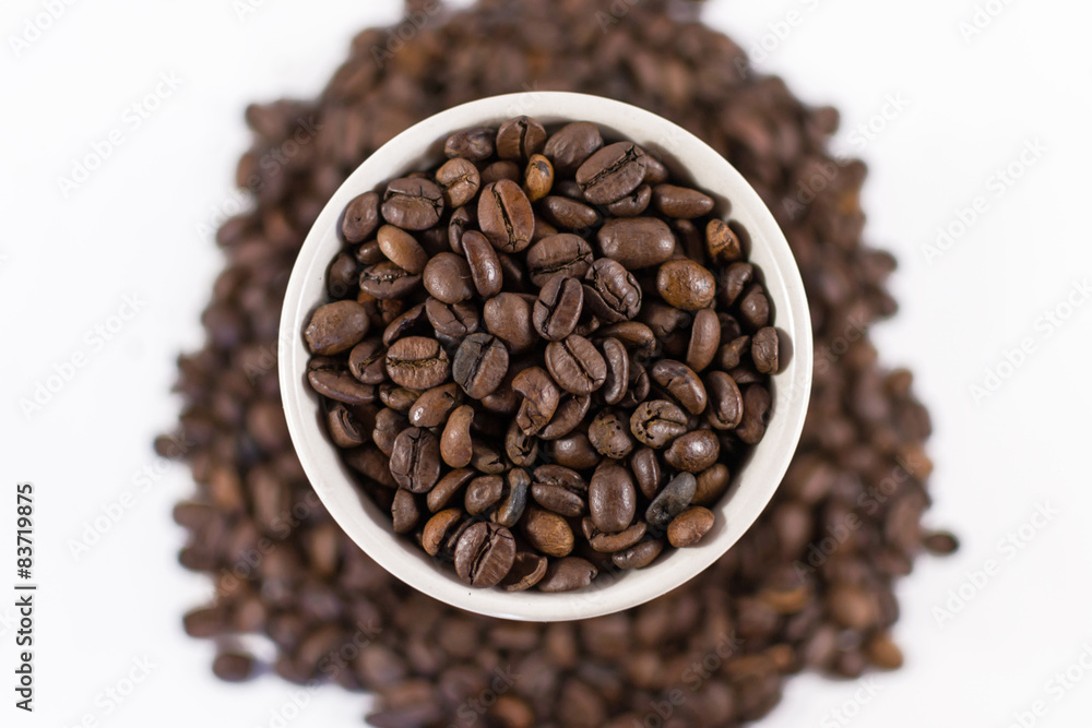 Overhead Roasted Coffee Beans in a Cup Overhead Roasted Coffee Beans in a Cup