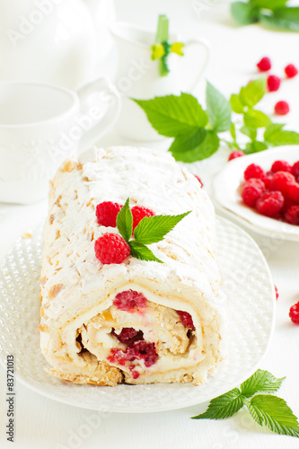 meringue roulade with cream and raspberries photo