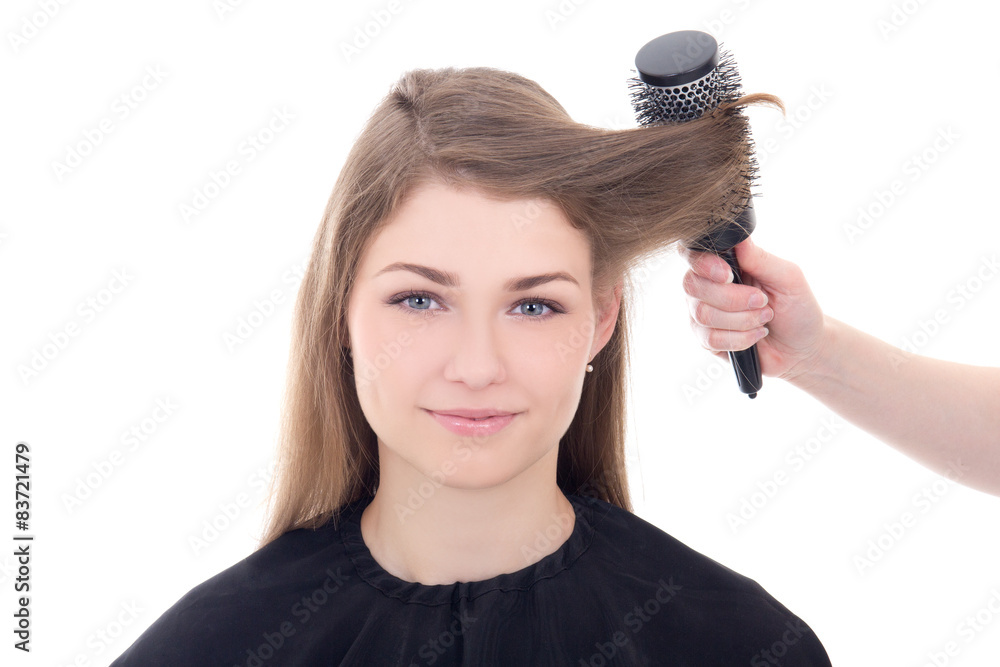 hairdresser doing haircut to young beautiful woman isolated on w hairdresser doing haircut to young beautiful woman isolated on w