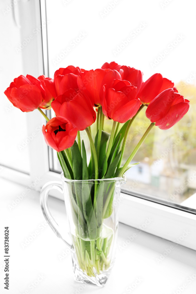 Bouquet of fresh tulips on windowsill background Bouquet of fresh tulips on windowsill background