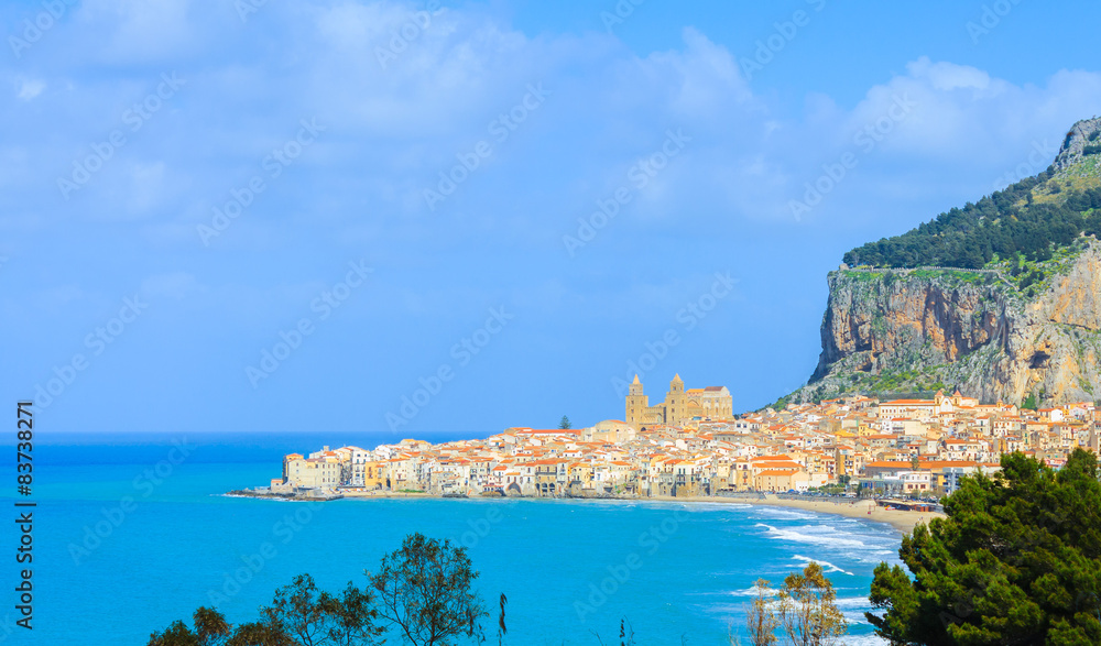 View of city Cefalu by the coastline on island Sicily, Italy.