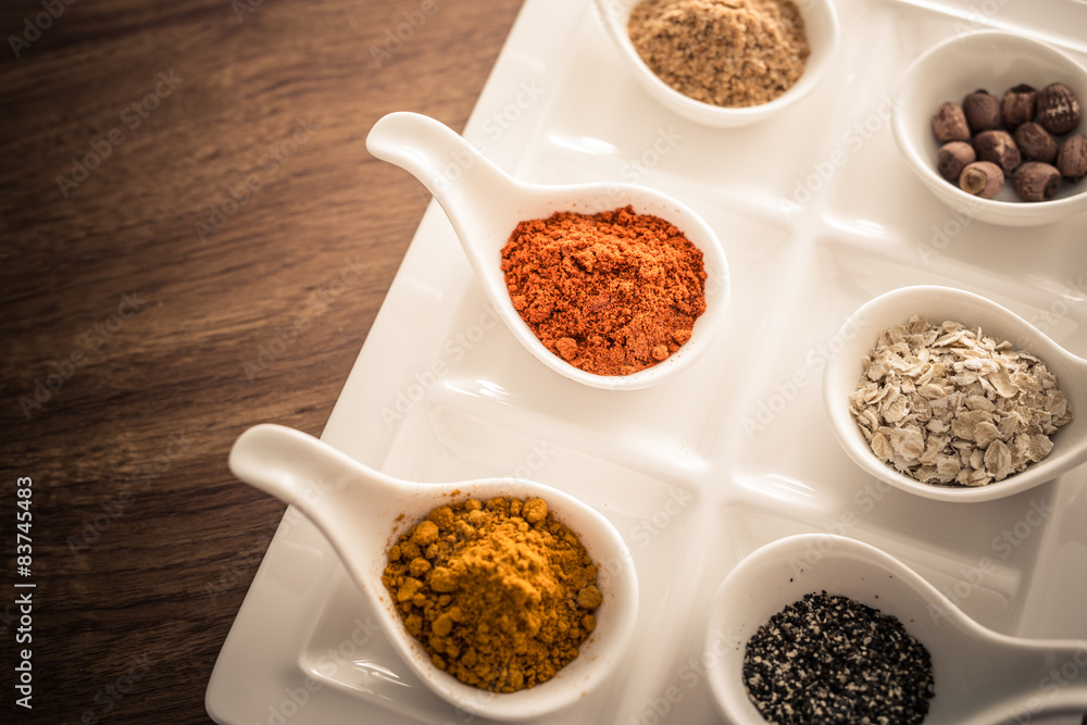 Wooden table of colorful spices Wooden table of colorful spices