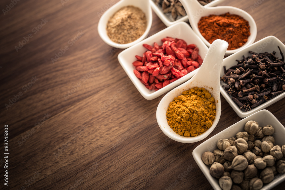 Wooden table of colorful spices Wooden table of colorful spices