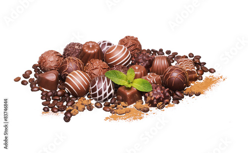 Chocolate candies. Pale of Belgian truffles isolated on white