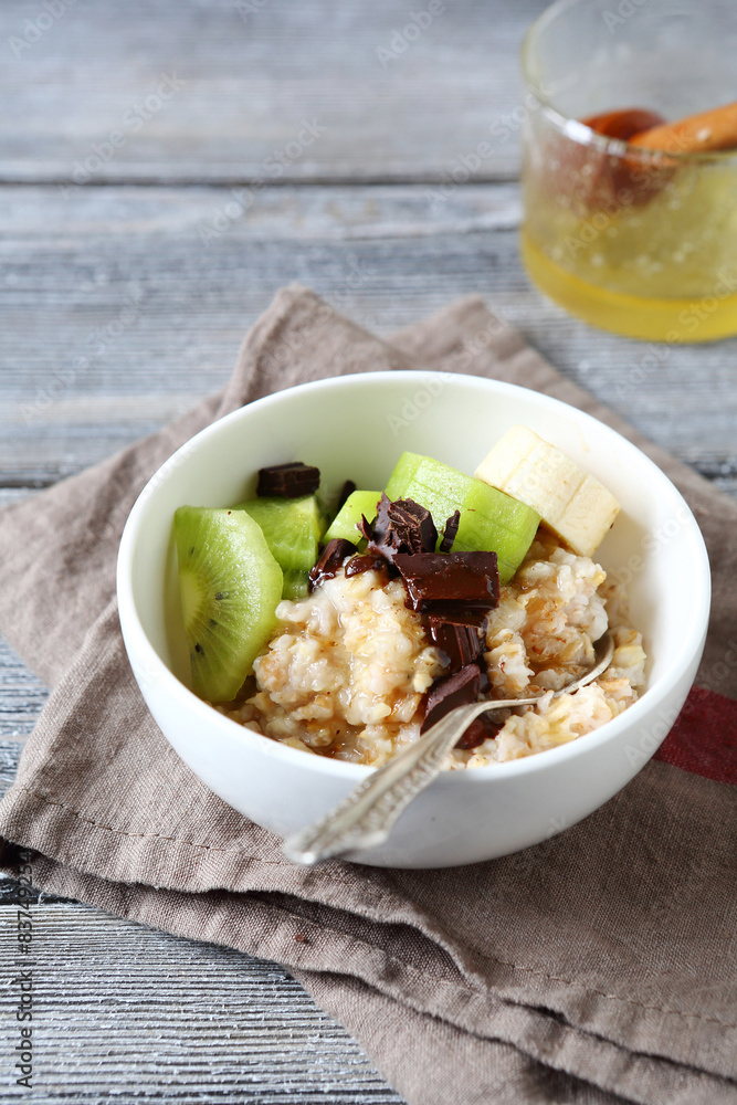 Sweet oatmeal with fruit and chocolate