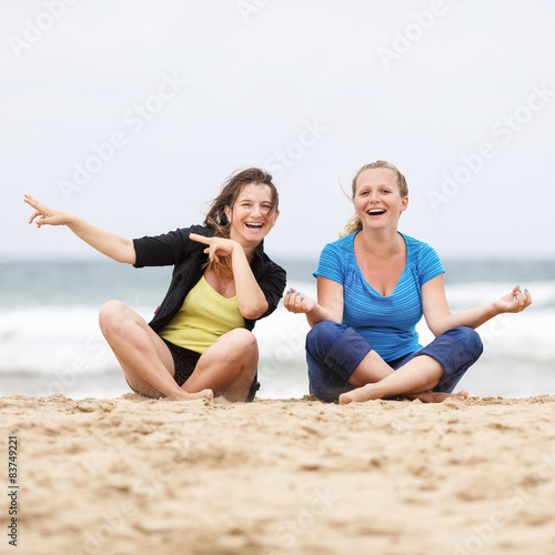 Two beautiful laughing young women