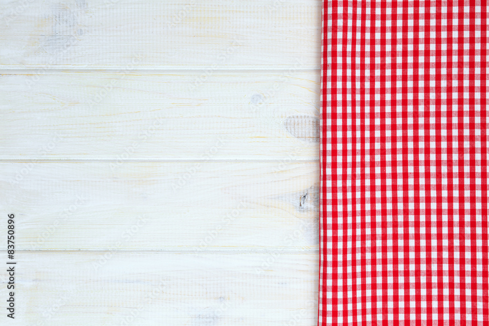 Red towel over wooden kitchen table. View from above with copy s Red towel over wooden kitchen table. View from above with copy s