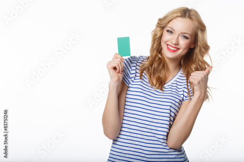 Smile the young woman showing the card of the blank credit and g