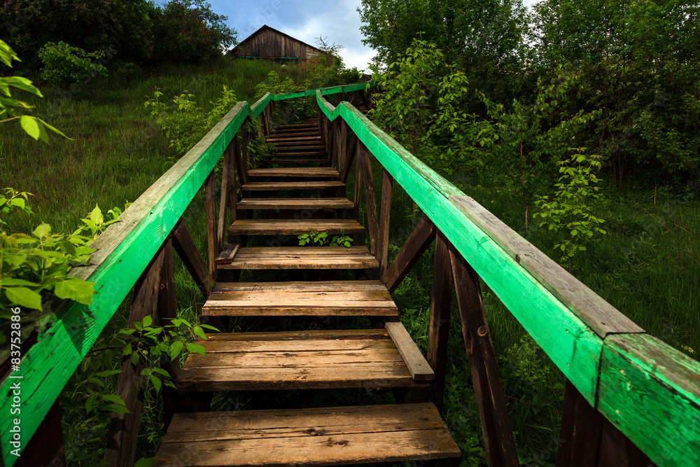 Old wooden ladder leading to the house Old wooden ladder leading to the house