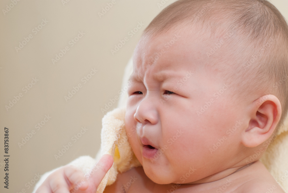 A cute little asian baby with surprise expression. A cute little asian baby with surprise expression.