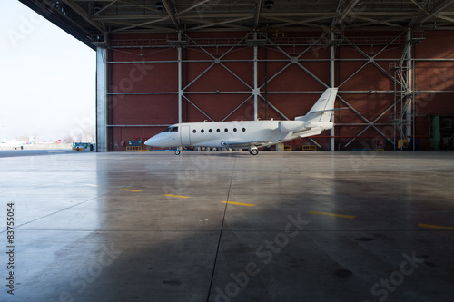 Business jet airplane is in hangar.