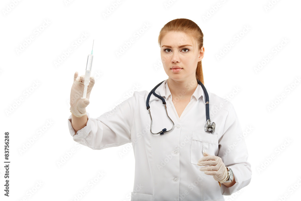 Portrait of an attractive young woman doctor with a syringe in h Portrait of an attractive young woman doctor with a syringe in h