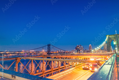 Brooklyn Bridge and Manhattan with lights and reflections. New Y