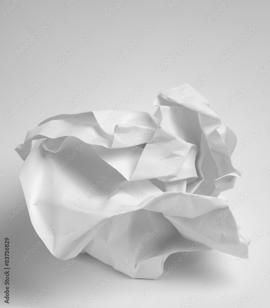 Crumbled up paper on white background Crumbled up paper on white background