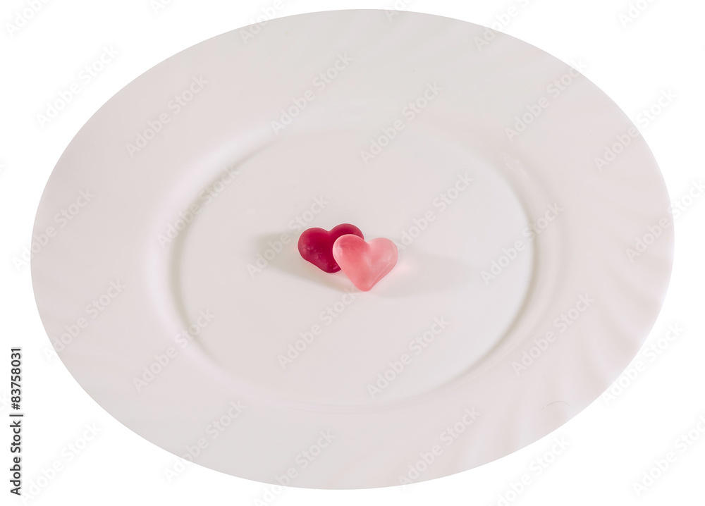 Colored heart shape jellies on a white plate Colored heart shape jellies on a white plate
