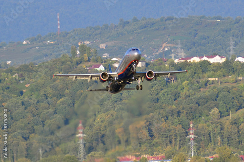 Airplane take-off in airport Sochi in September 12, 2012.  photo