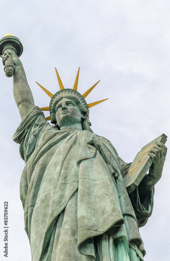 Fototapeta premium Statue of Liberty in Paris. Bottom-Up view from street