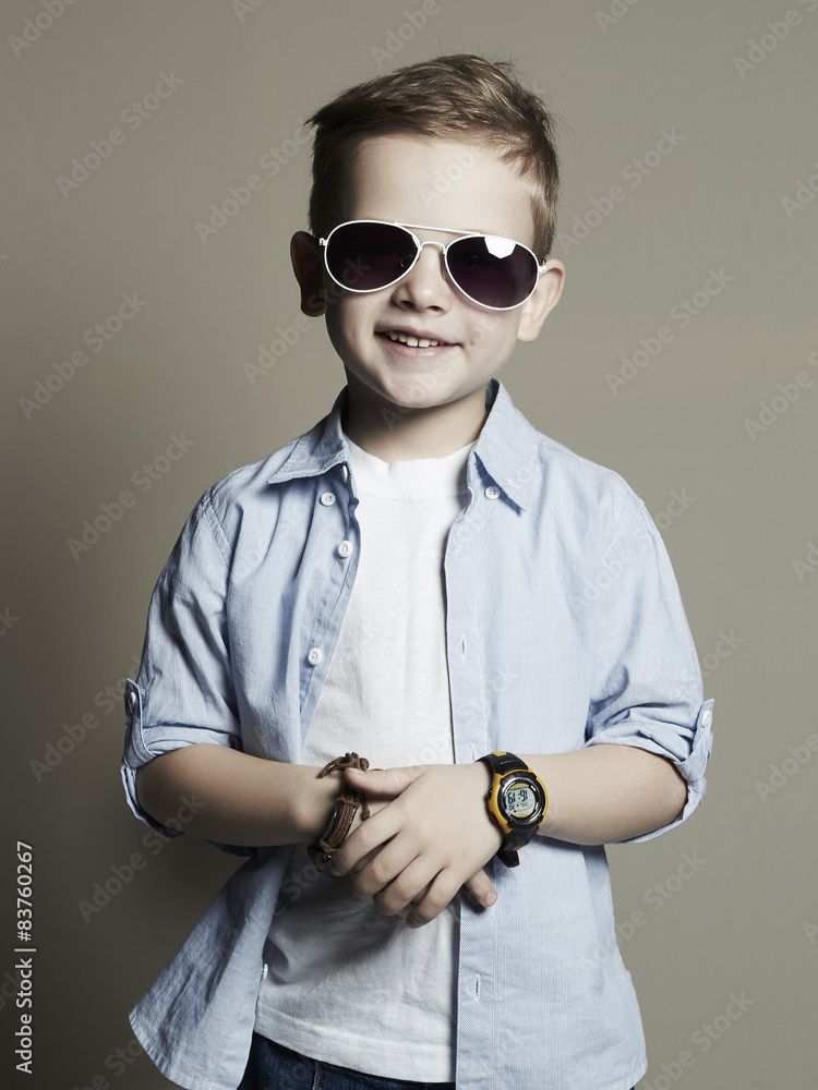 Funny child.fashionable little boy in sunglasses StockFoto Adobe Stock