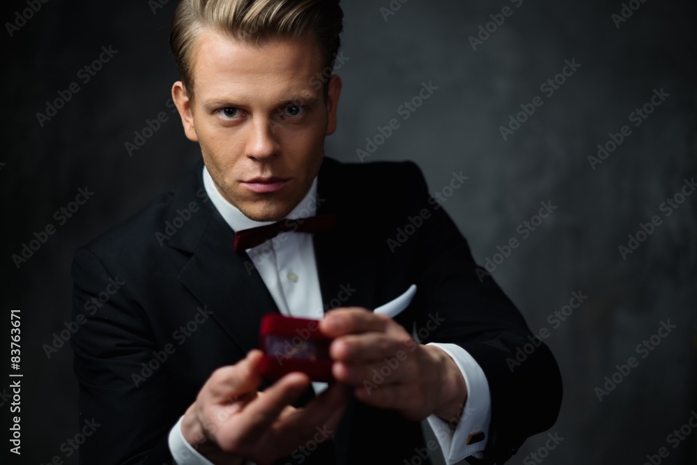 Man holding box with a proposal ring Man holding box with a proposal ring