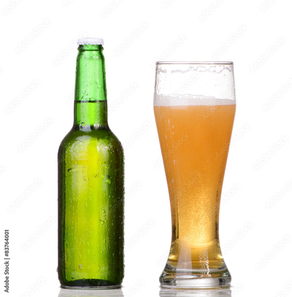 Chilled green bottle with condensate and a glass Chilled green bottle with condensate and a glass
