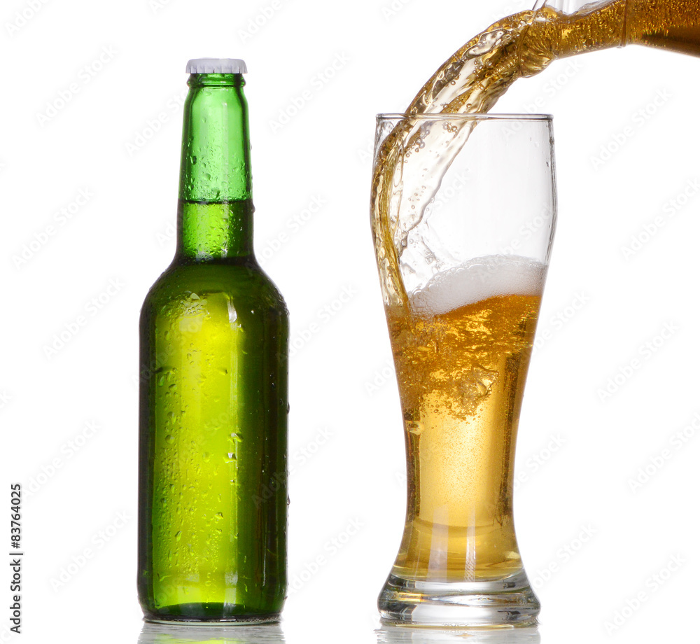 Pouring beer from bottle isolated on white background Pouring beer from bottle isolated on white background