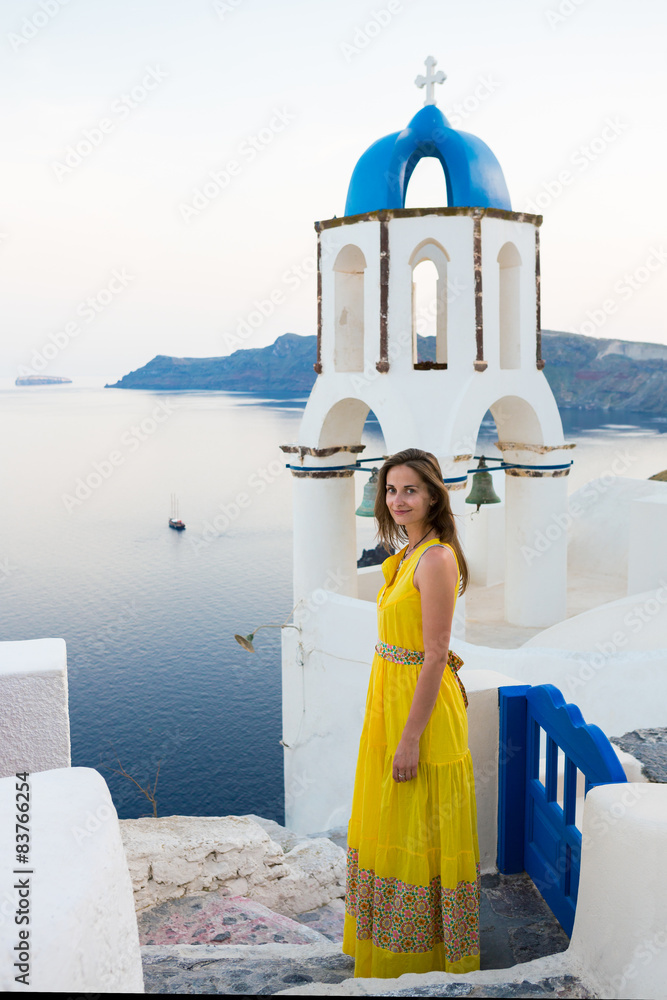 beautiful girl walking on Oia Santorini Greece