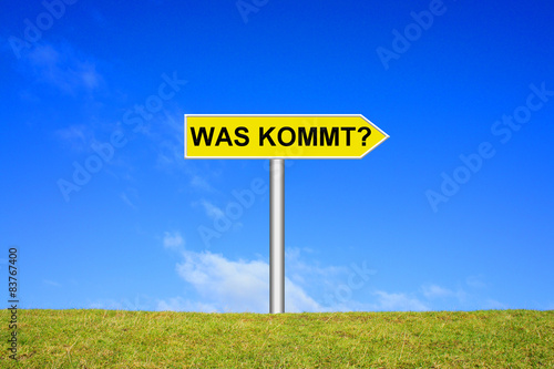 Schild Wegweiser: Was kommt? photo