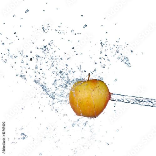 Apple in spray of water. Juicy apple with splash on white 