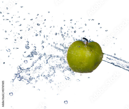 Green apple slices with water splash