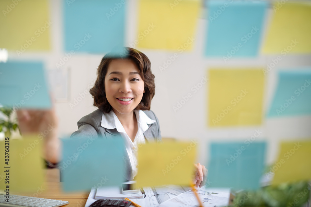 Sticking notes on glass wall Sticking notes on glass wall