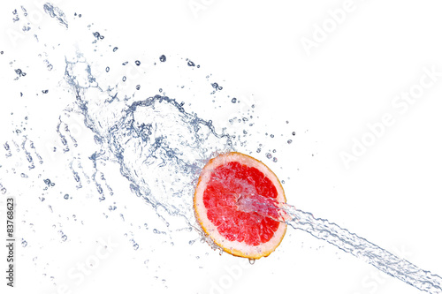 fresh grapefruit with water splash, isolated 