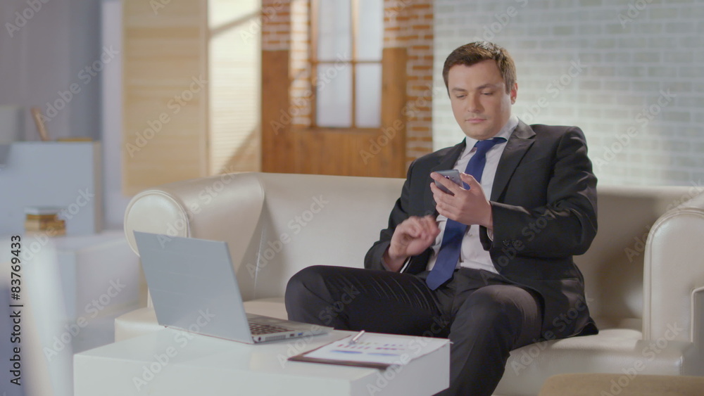 Business analyst dialing number, making phone call luxury office Business analyst dialing number, making phone call luxury office