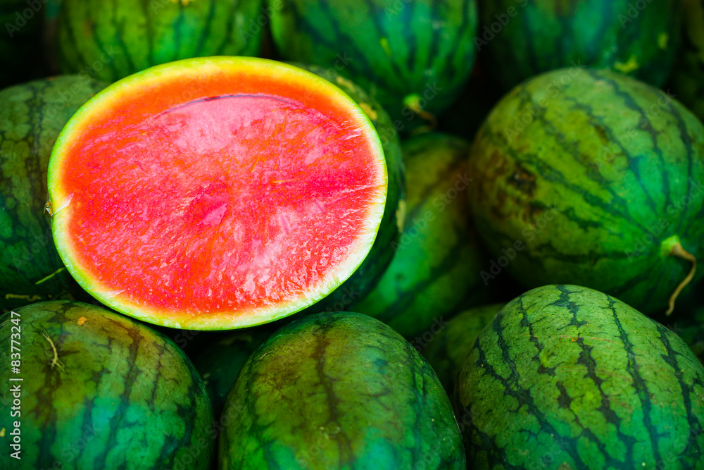 Fresh watermelons on shelves in the market or supermarket, Healthy fruit and drink, Closeup green watermelons on fruit background. Fresh watermelons on shelves in the market or supermarket, Healthy fruit and drink, Closeup green watermelons on fruit background.