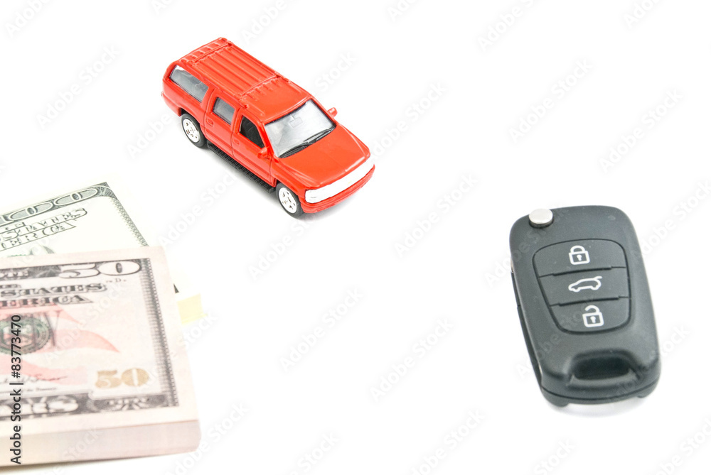 red car, keys and money on white red car, keys and money on white