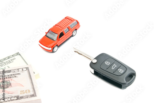 keys, money and red car on white