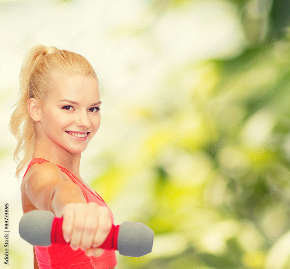 smiling beautiful sporty woman with dumbbell smiling beautiful sporty woman with dumbbell