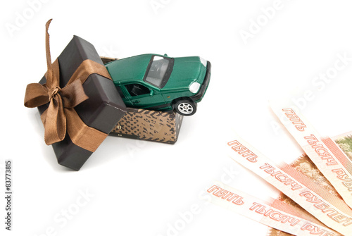green car in brown gift box and banknotes