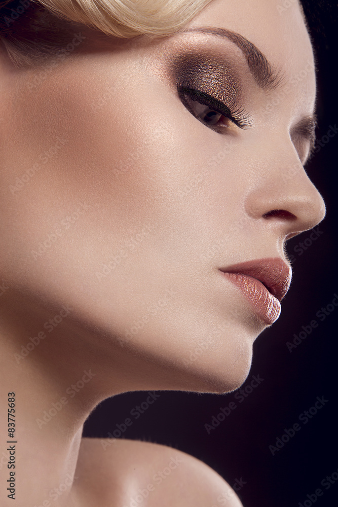 Beautiful blonde girl with perfect skin. Picture taken in the studio on a black background Beautiful blonde girl with perfect skin. Picture taken in the studio on a black background