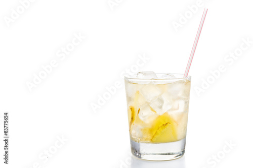 Refreshing ice cold ginger tea in transparent glass