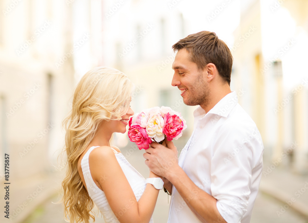couple with flowers in the city couple with flowers in the city