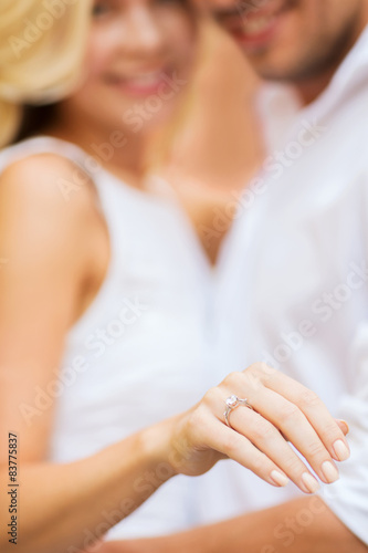 romantic man proposing to beautiful woman