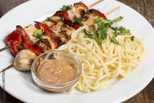 Party dish.Chicken barbecue with spaghetti  photo