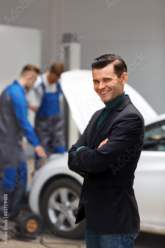 Portrait of Happy Customer in Auto Repair Shop 
