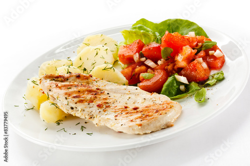 Grilled chicken fillet, boiled potatoes and vegetable salad 