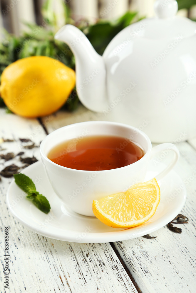Green tea in cup and teapot Green tea in cup and teapot
