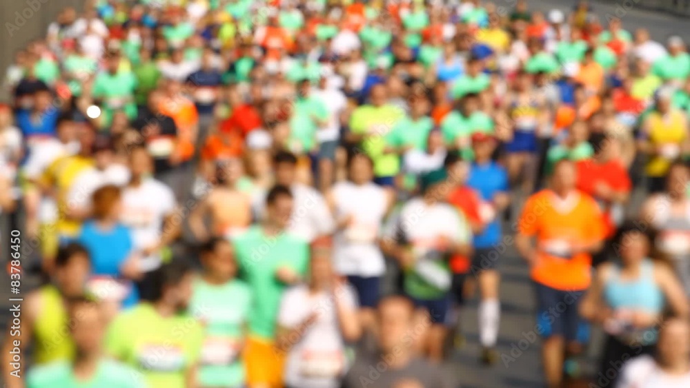 Blurred mass of marathon out runners people Blurred mass of marathon out runners people