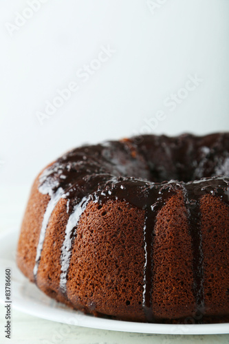 Chocolate bundt cake on wooden background