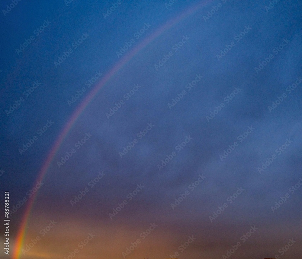 Rainbow during an approaching storm, dramatic, dark clouds