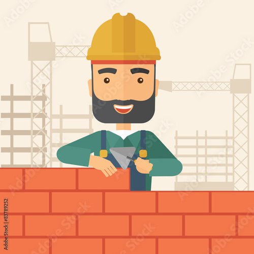 Builder man is building a brick wall.