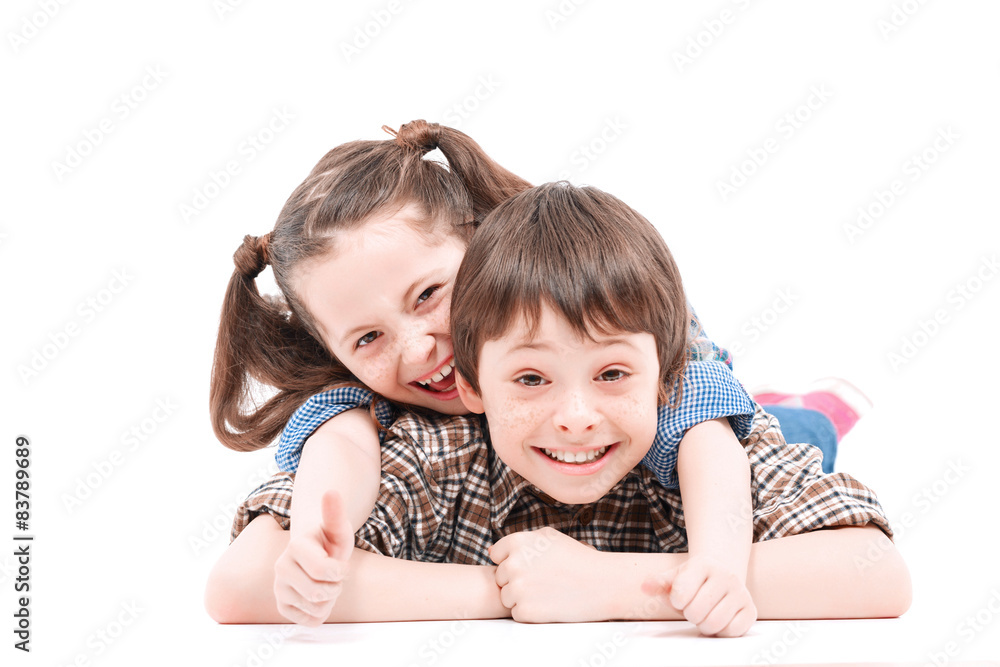 Brother and sister having fun on the floor Brother and sister having fun on the floor